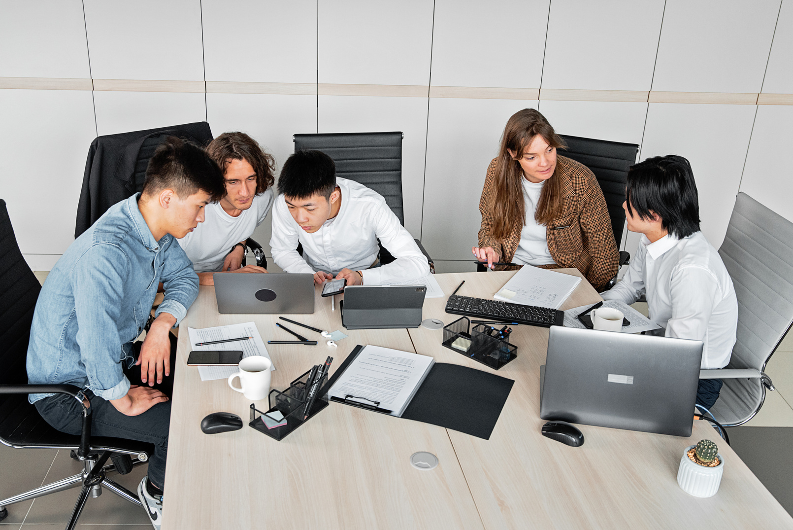 A Group of People Discussing in an Office